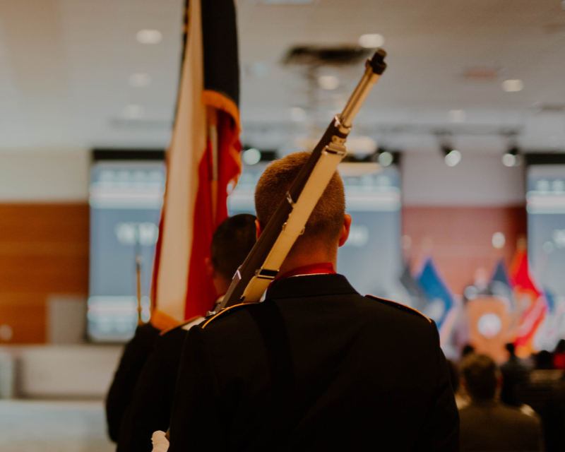 Army ROTC color guard preparing to post the flag